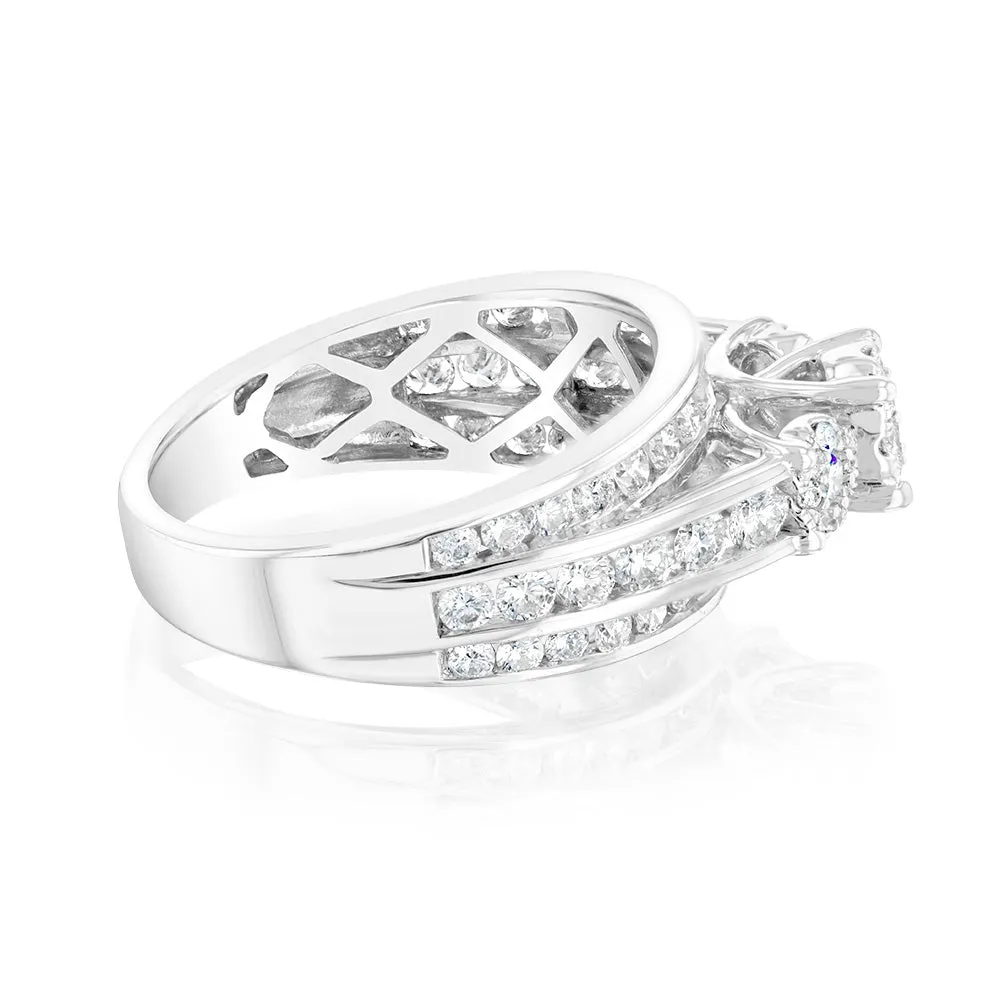 14ct White Gold 1.5 Carat Diamond Trilogy Ring with 3 Round Brilliant Cut Diamonds Surrounded by Diamond Halos and Channel Set Band Shiels