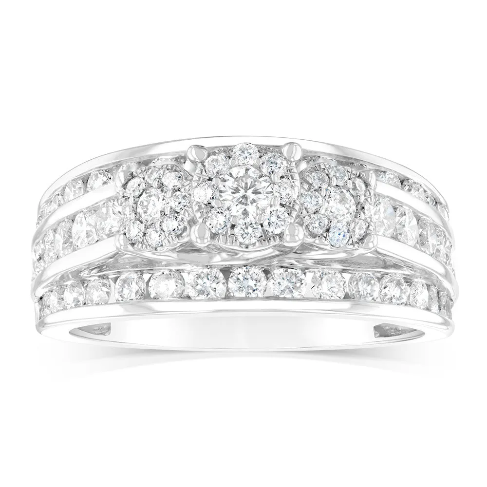 14ct White Gold 1.5 Carat Diamond Trilogy Ring with 3 Round Brilliant Cut Diamonds Surrounded by Diamond Halos and Channel Set Band Shiels