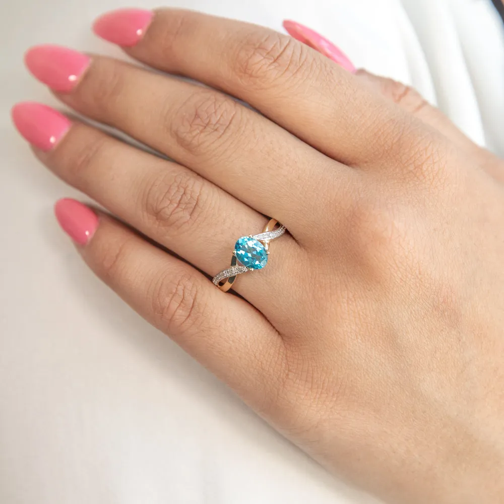 9ct Yellow Gold Blue Topaz and Diamond Cross Over Ring Shiels