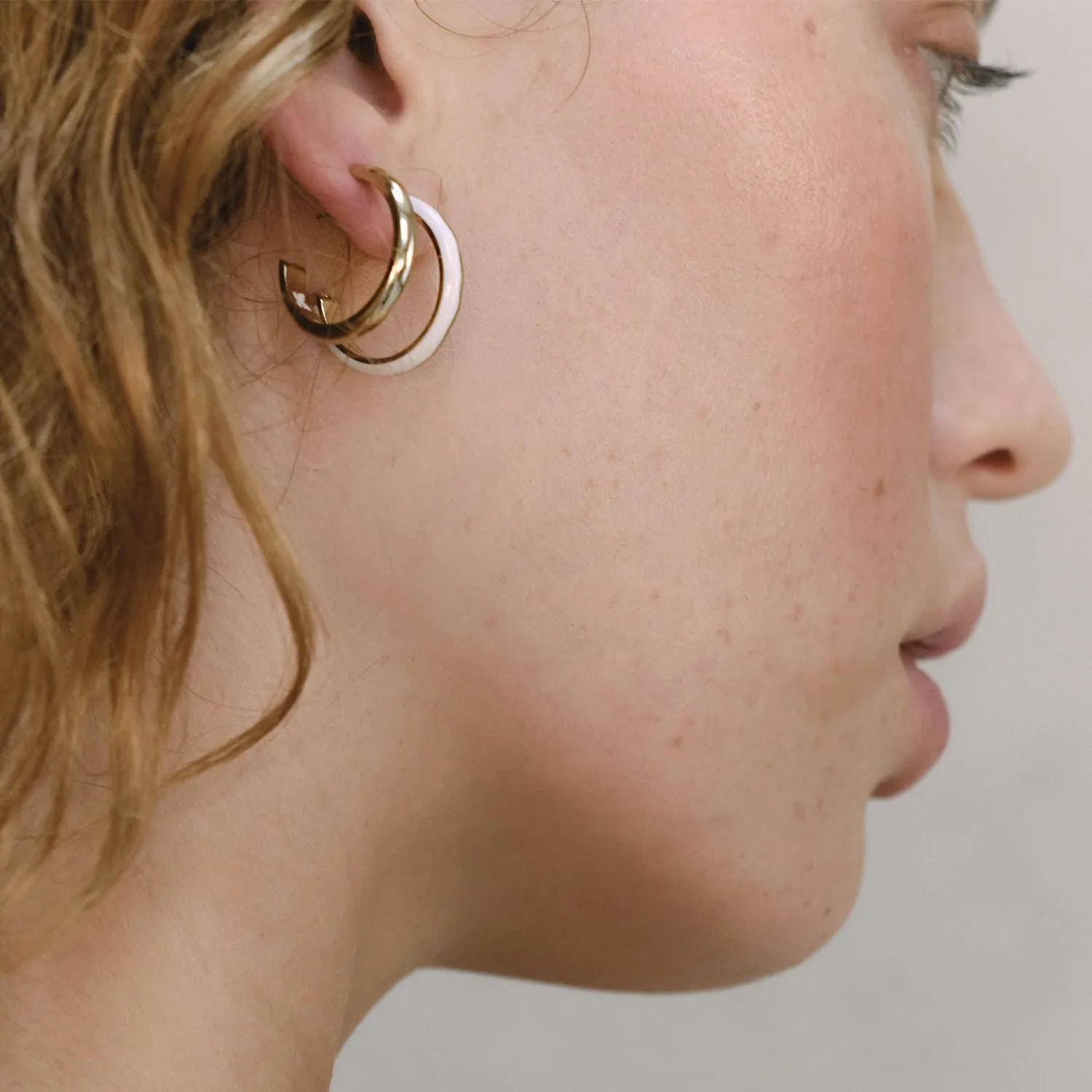 A. Iceberg 18K Gold Plated SM Hoops w. Snow White Enamel